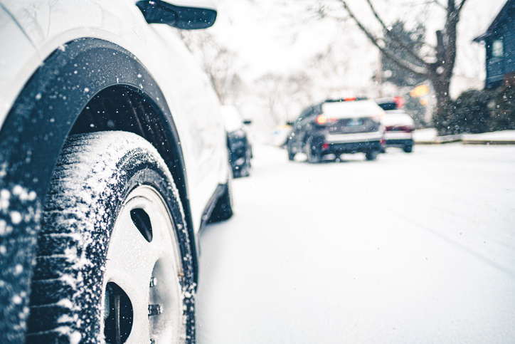 Car tire in the winter on snowy roads.