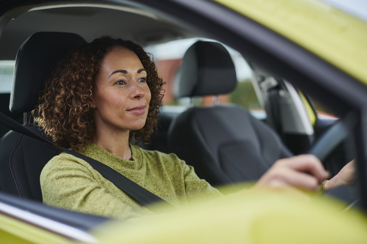 Woman driving car.