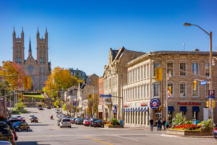 People walk along Macdonell street in downtown Guelph Ontario Canada.